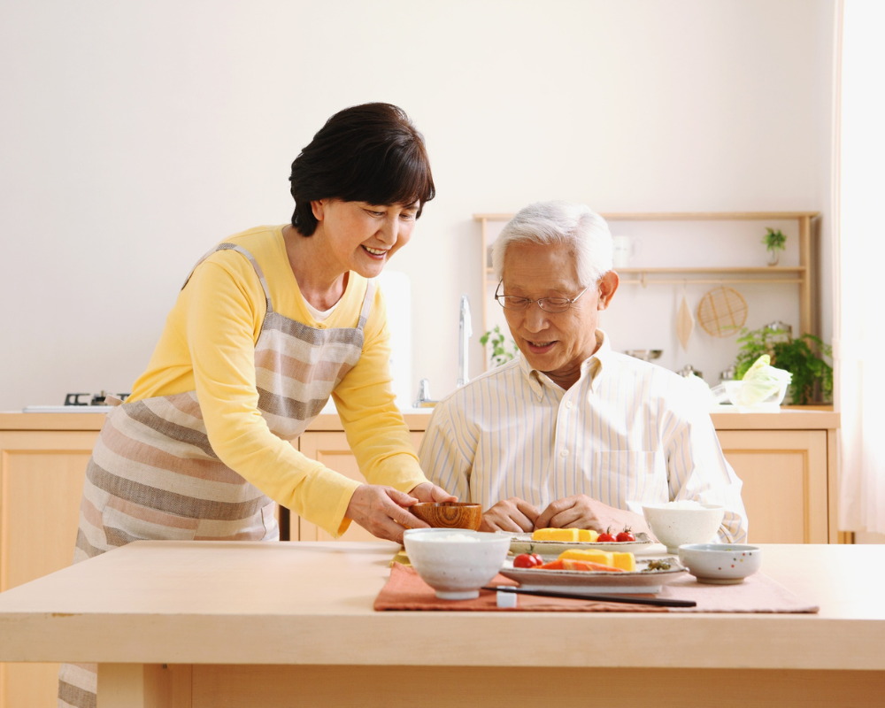 Caregiver preparing a meal for a client